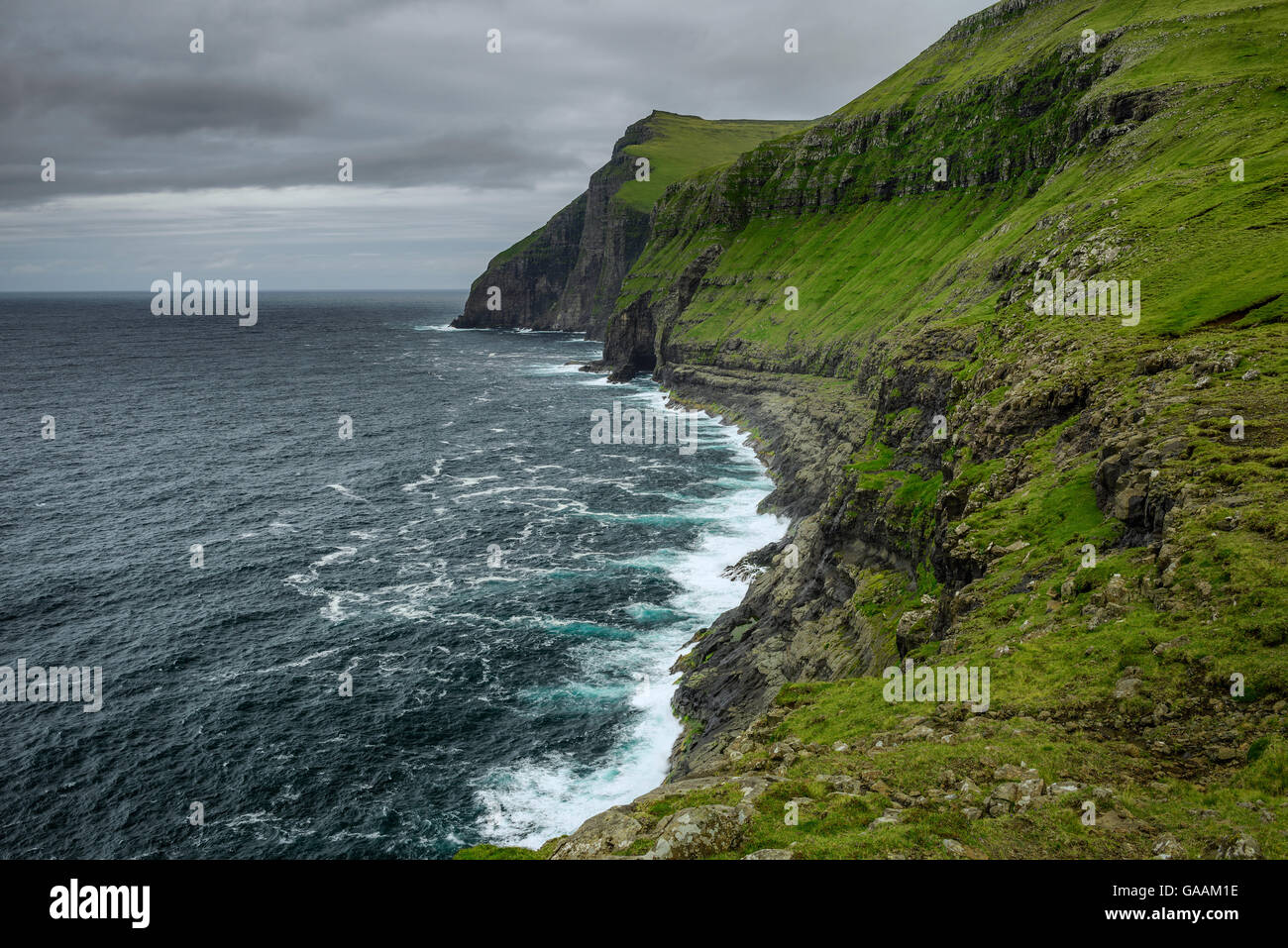 Giant sea cliffs shortly after storm on Faroe Islands Stock Photo