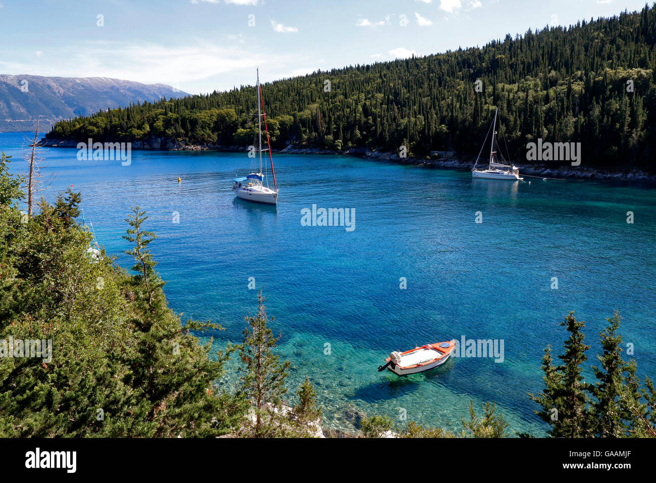 - Blue waters of Foki Fiskardo Beach. Fiskardo, Kefalonia, Greece Stock Photo