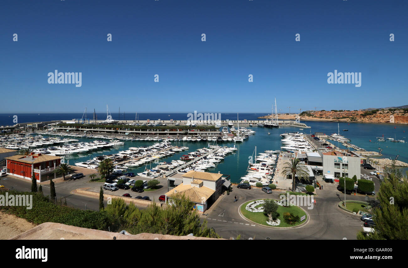 View over Port Adriano marina - original marina in the foreground and Philippe Starck designed superyacht marina and commercial Stock Photo