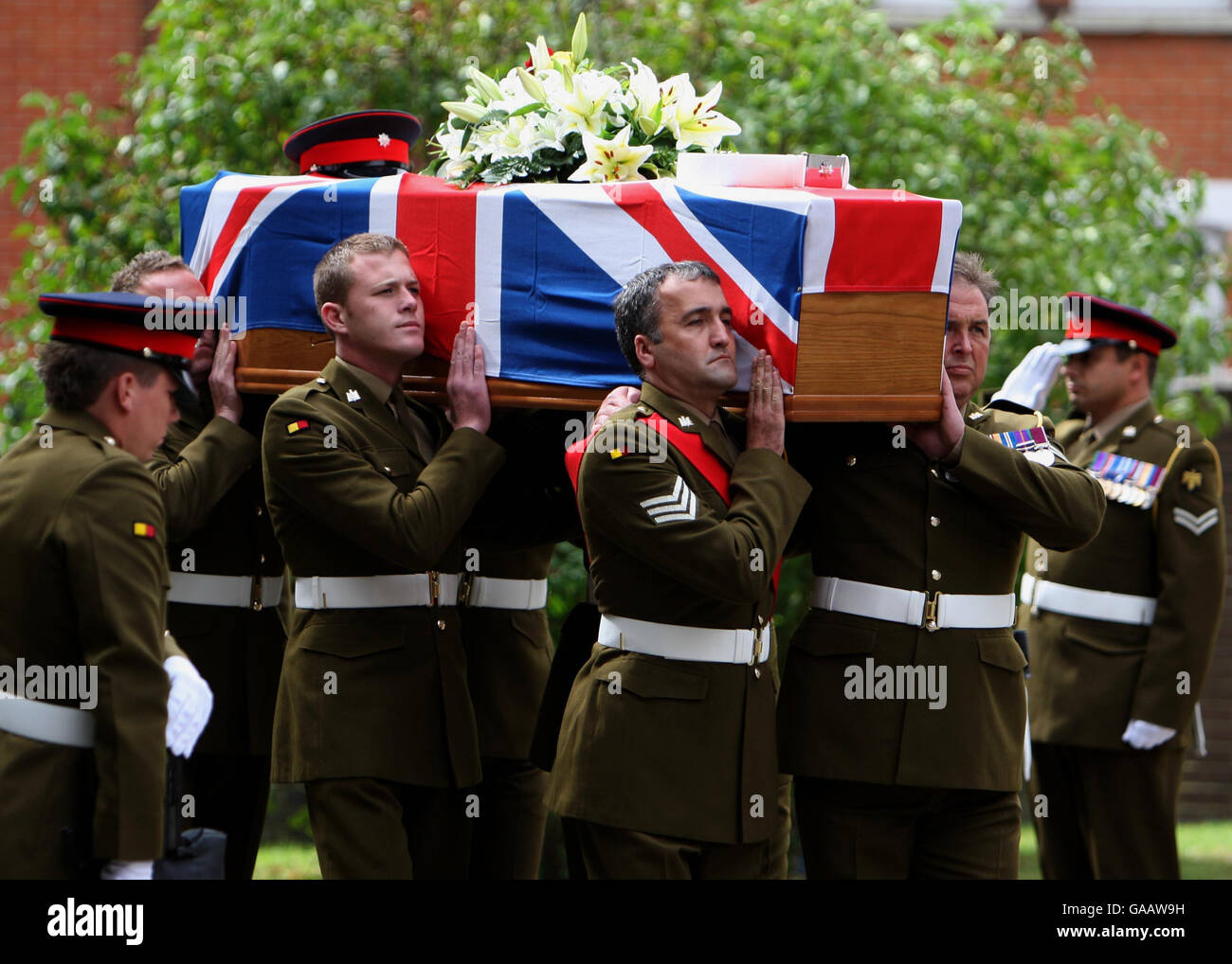 The coffin of Private Aaron James McClure, leaves St Thomas' Church in Ipswich following his funeral. Stock Photo