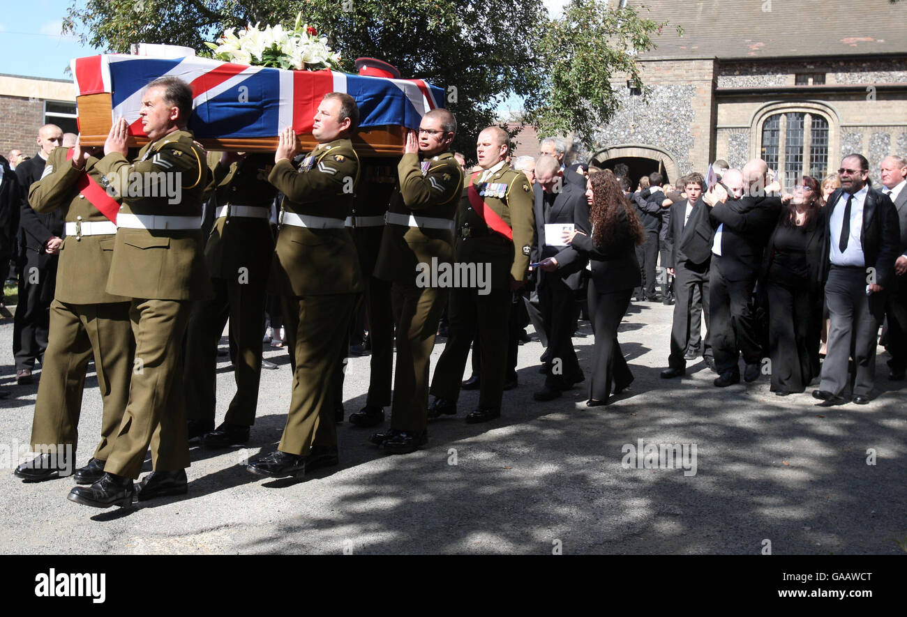The coffin of Private Aaron James McClure, leaves St Thomas' Church in Ipswich following his funeral. Stock Photo