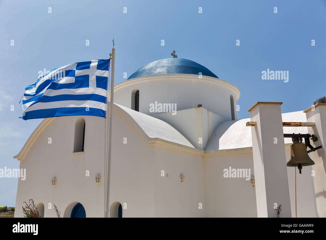 Greek orthodox church with national flag closeup in Paphos, Cyprus. Stock Photo