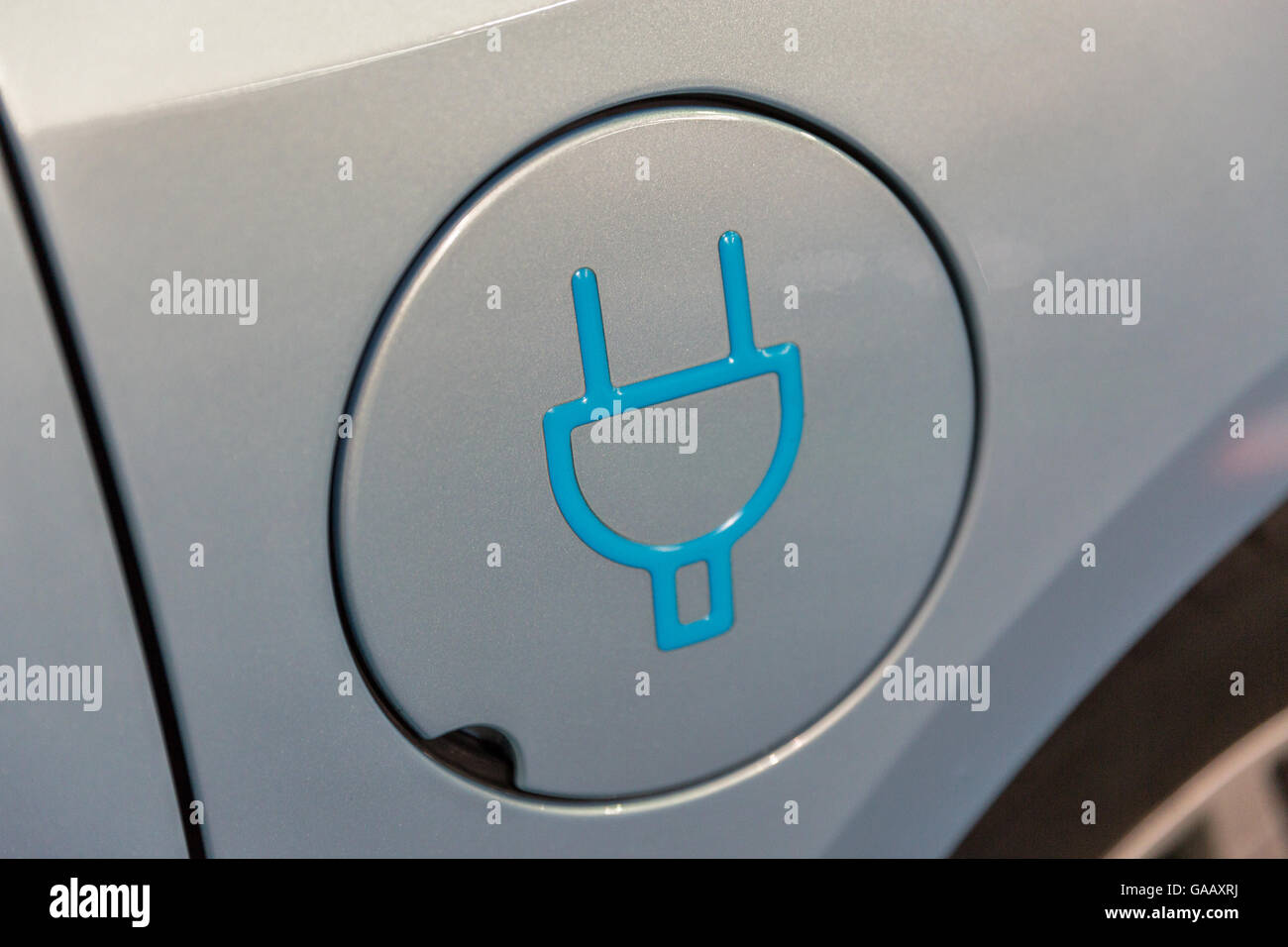 Charging symbol on electric car closeup Stock Photo