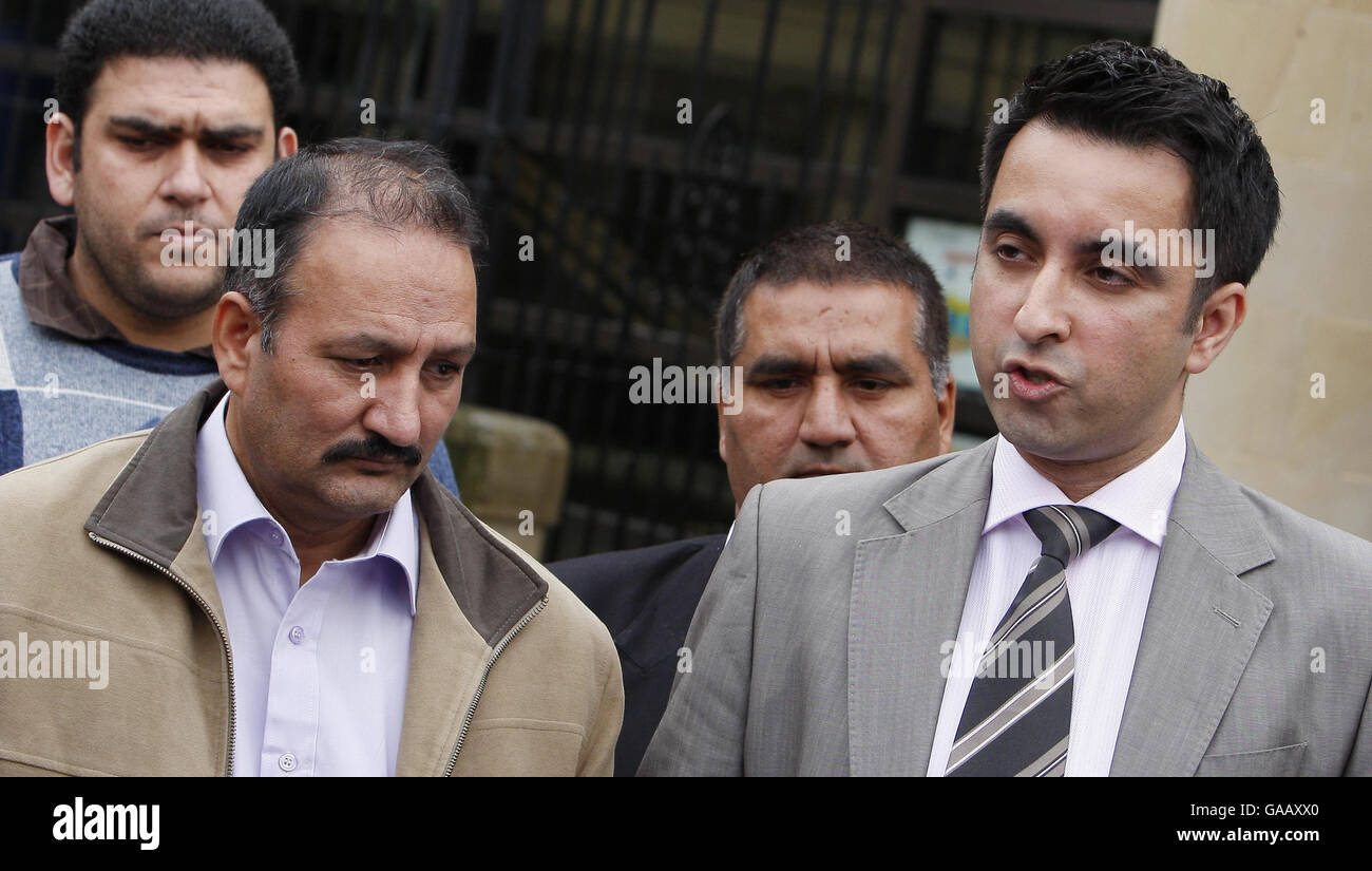 Solicitor Aamer Anwar (right) and the family of Mohammed Atif Siddique outside the High Court in Glasgow after British-born Muslim student Siddique, 21, was found guilty of a series of Islamist terrorism offences. Stock Photo