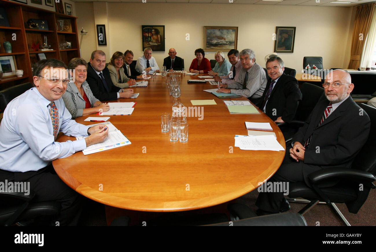 Rhodri Morgan chaired the first meeting of his coalition Cabinet today as ministers met in his fifth-floor office in Cardiff Bay ahead of the Assembly's first plenary session after the summer recess tomorrow. From left to right: Andrew Davies, Jane Hutt, Carl Sergeant, Jane Davidson, Rhodri Glyn Thomas, Carwyn Jones, Brian Gibbons, Elin Jones, Edwina Hart, Sir John Shortridge, Rhodri Morgan, Ieuan Wyn Jones and Lawrence Conway. Stock Photo