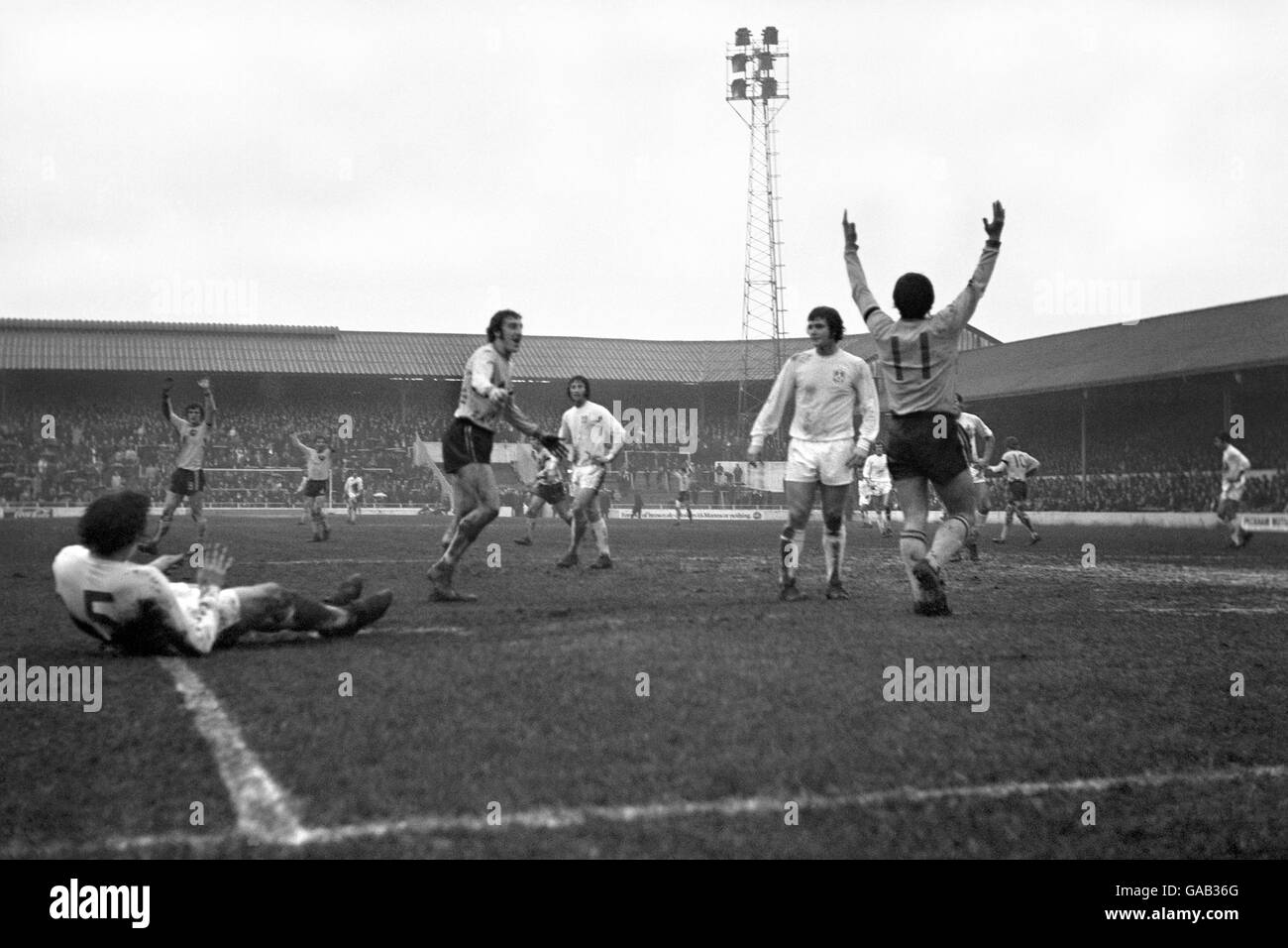 Millwall's Barry Kitchener (No.5) is left sprawling on the ground at The Den as Norwich score. Stock Photo