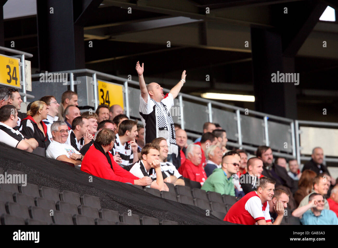 Soccer - Coca-Cola Football League Two - Milton Keynes Dons v Darlington - Stadium:mk. A single Darlington fan chants in the crowd. Stock Photo