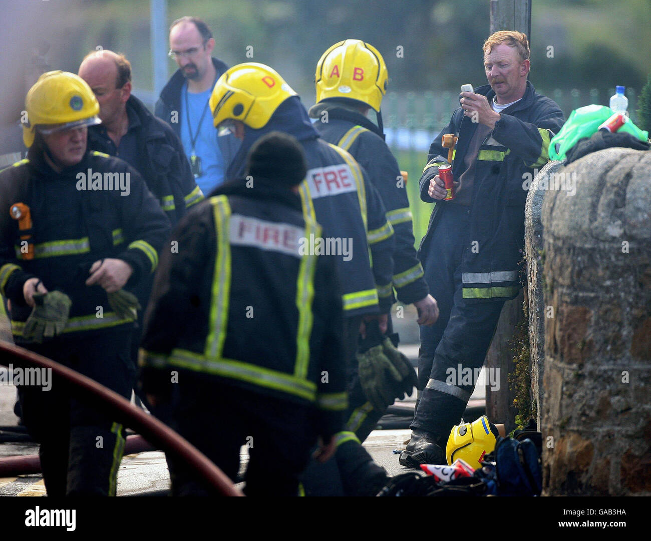Firefighters killed in warehouse blaze. Firefighters stand at the scene of a fire in Bray, Co Wicklow were two firefighters lost their lives today. Stock Photo