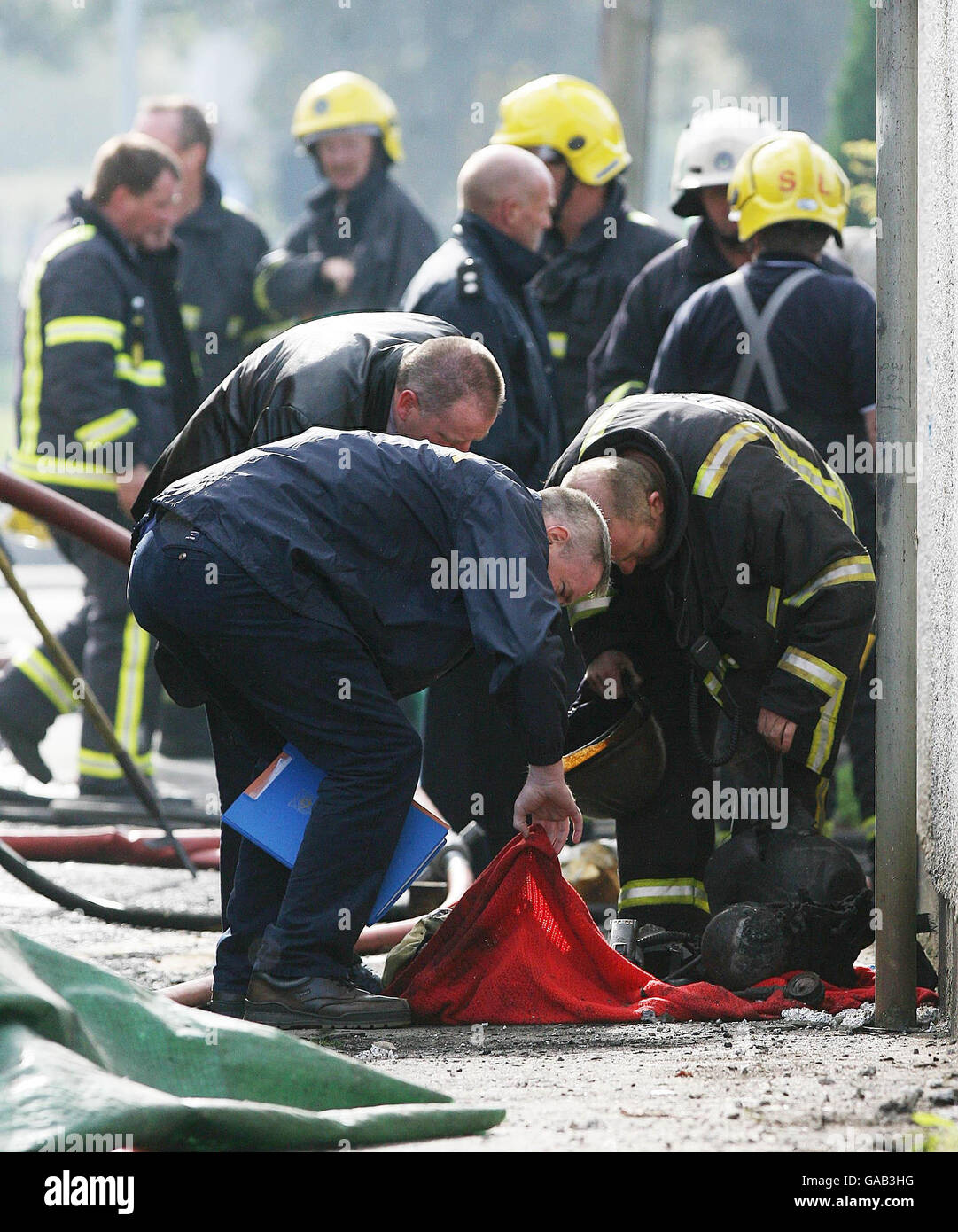 Garda investigators stand at the scene of a fire in Bray, Co Wicklow were two firefighters lost their lives today. Stock Photo