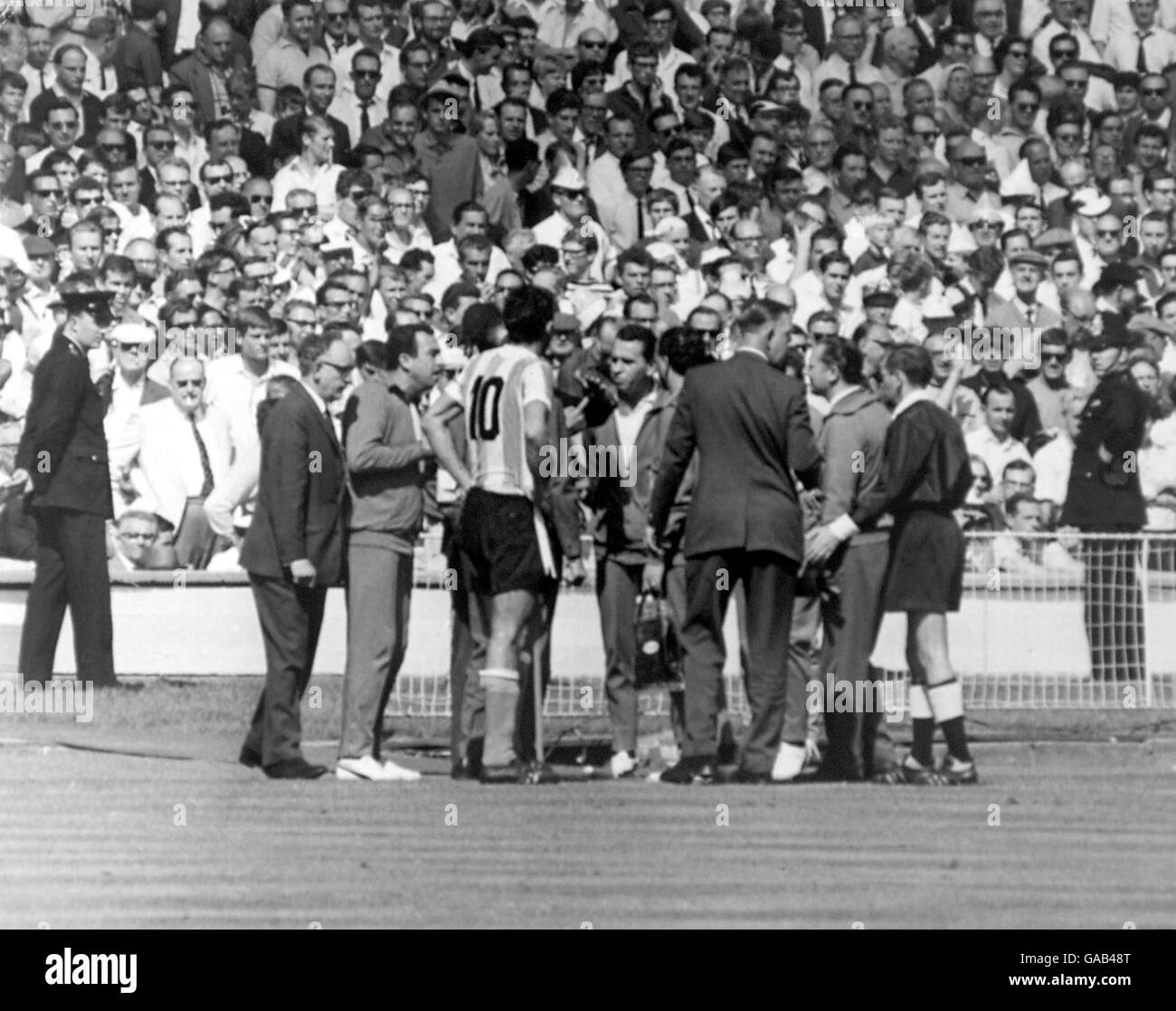 A prolonged arguament between officials and players breaks out after West German Referee Rudolph Kreitlein sent off Argentina's Antonio Rattin (in 10 shirt) Stock Photo