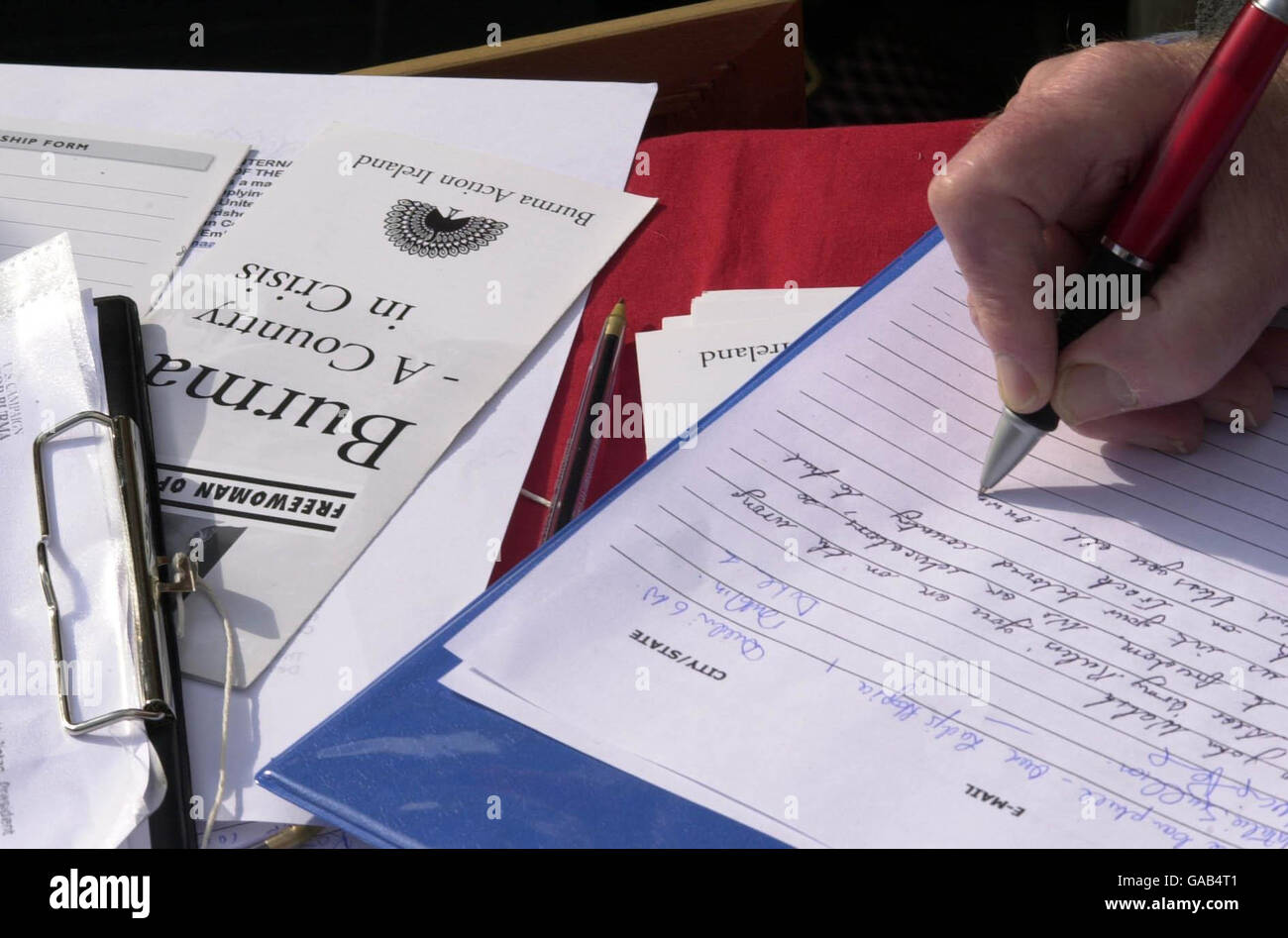 Supporters of the Burma pro-democracy movement sign a petition at a rally in Dublin's O'Connell Street. Stock Photo