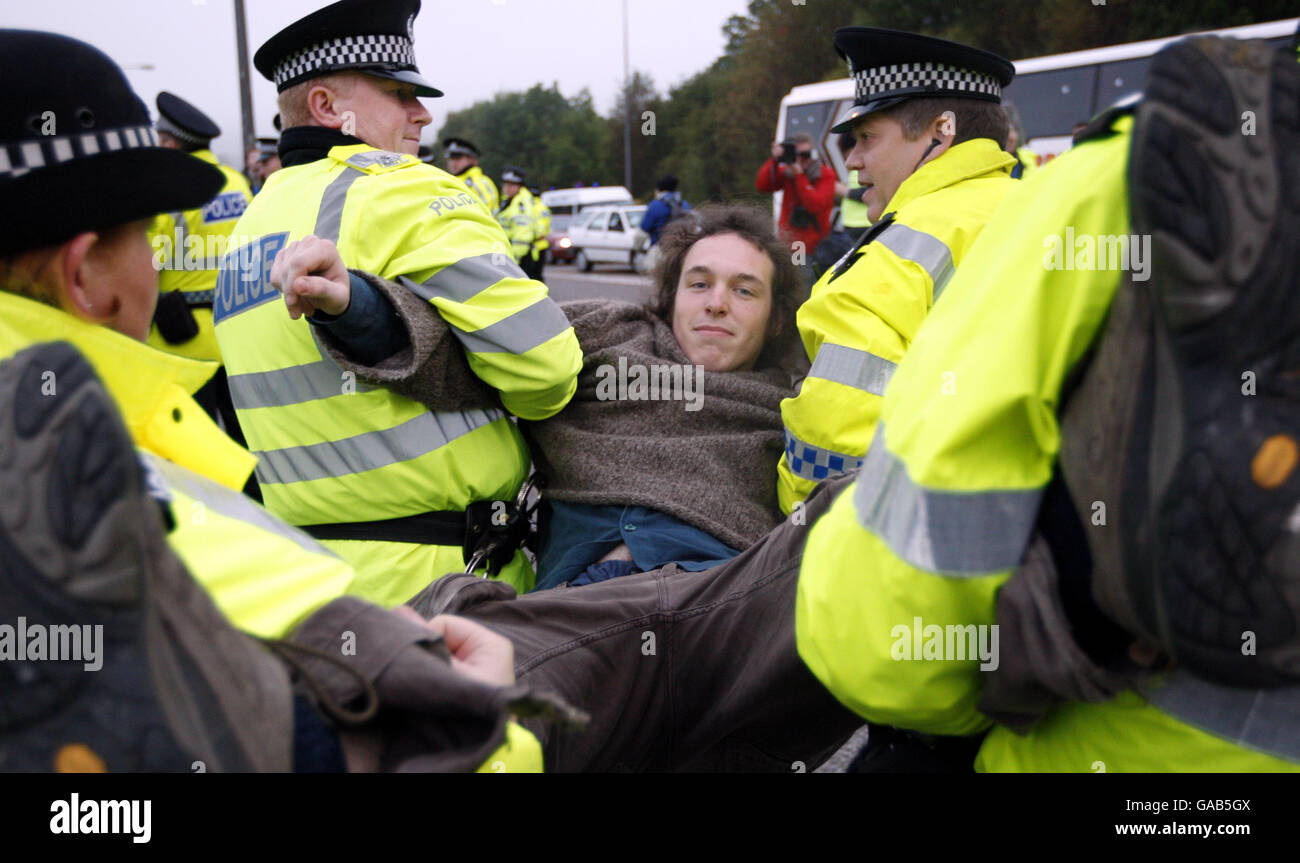 A protester is carried away by police at Faslane Naval Base during the last day of a year long anti nuclear protest at the site. Stock Photo