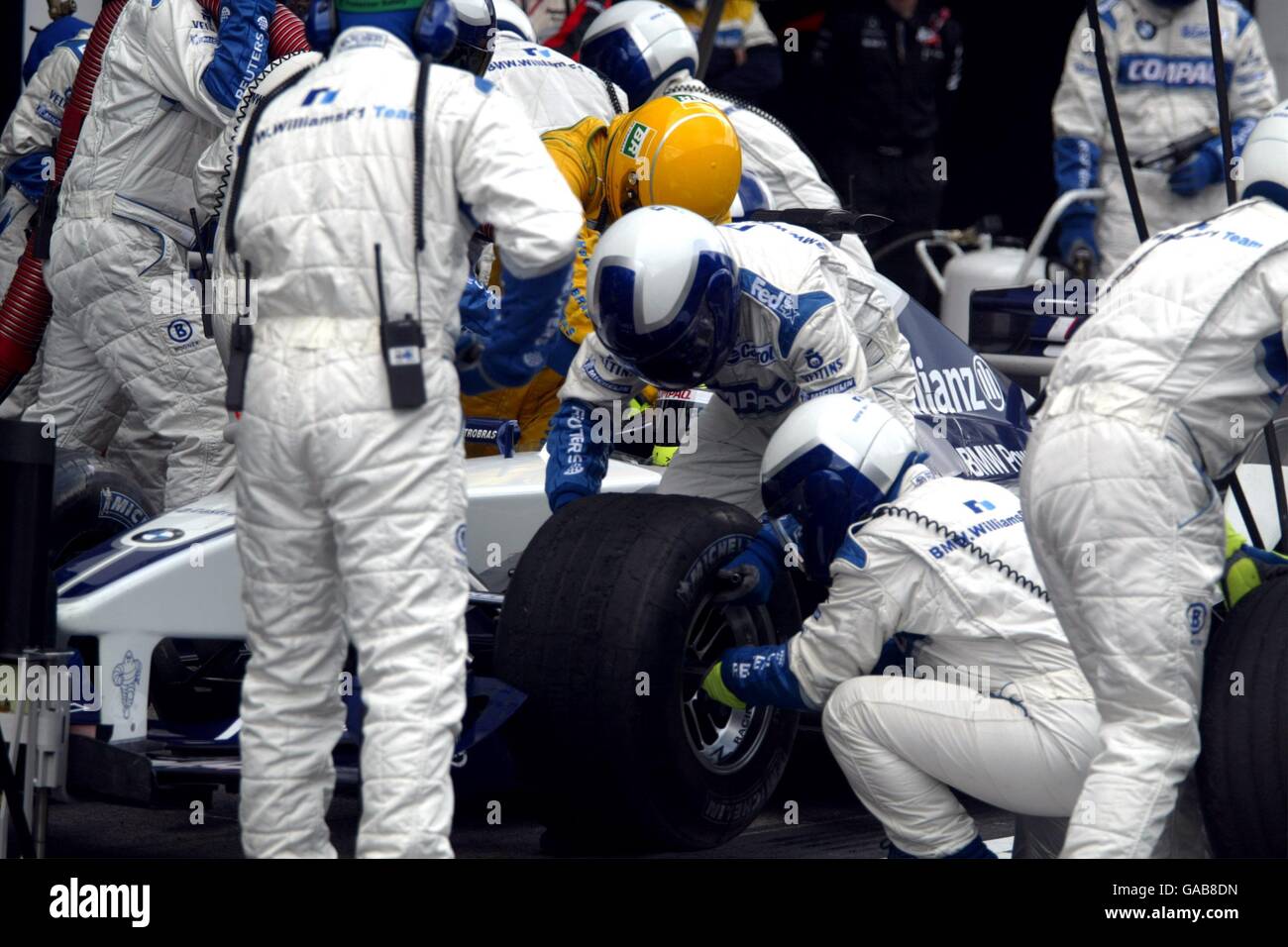 The bmw mechanics work on ralf schumachers car hi-res stock photography
