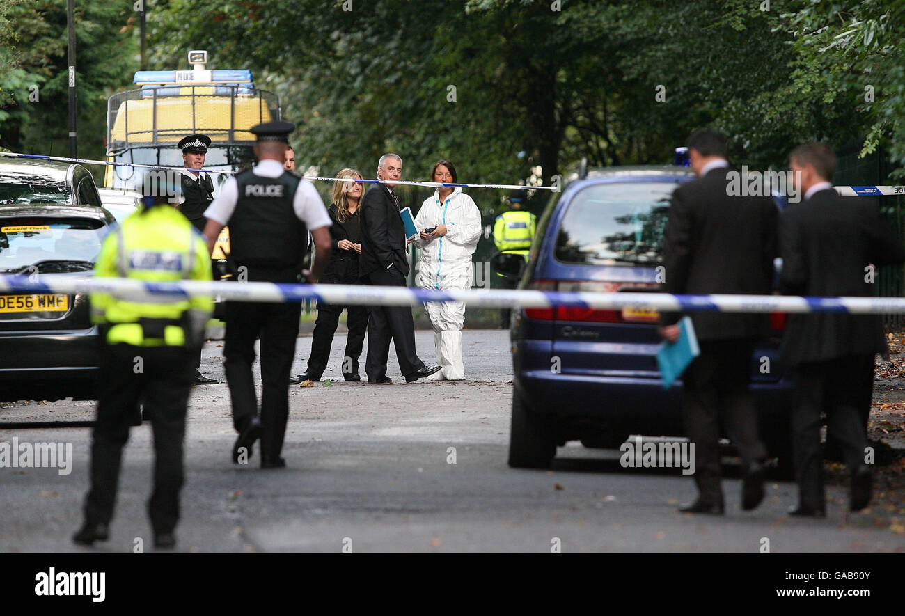 Police and forensic officers outside St Edwards College, in Sandfield