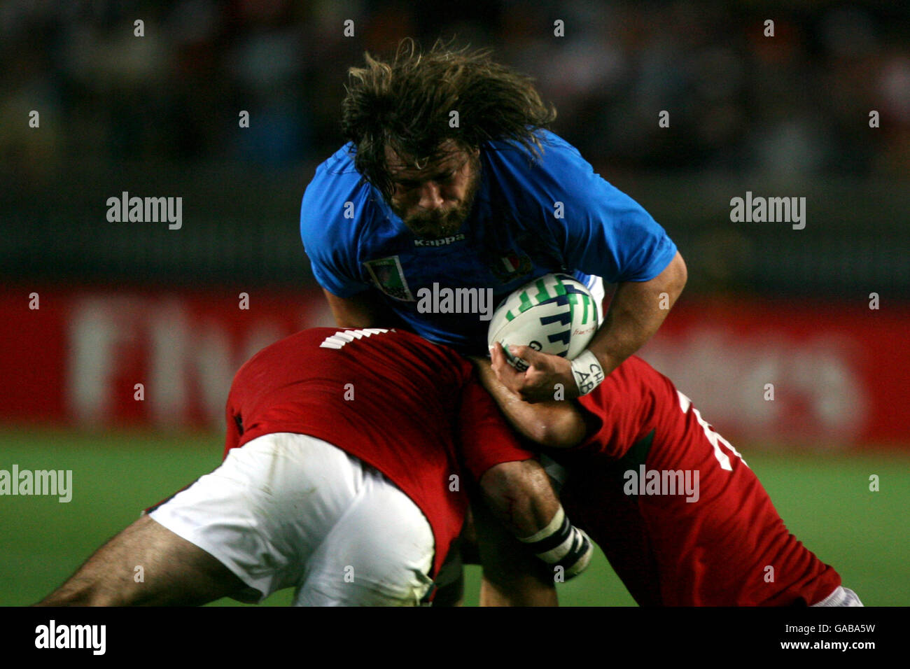 Rugby Union - IRB Rugby World Cup 2007 - Pool C - Italy v Portugal - Parc des Princes. Italy's Martin Castrogiovanni is tackled by two Portugal players Stock Photo