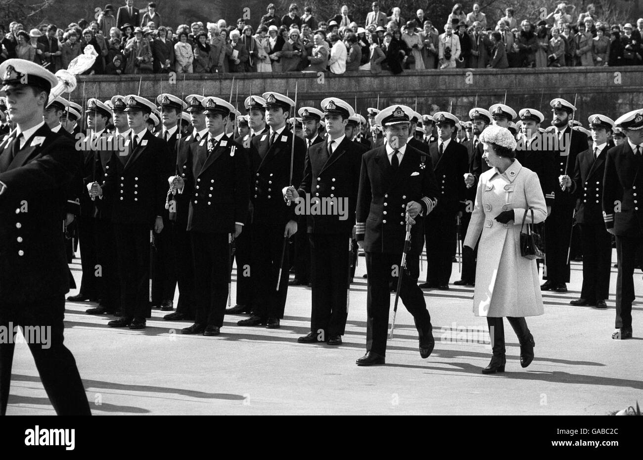The Queen, accompanied by Captain N.J.S Hunt, at Britannia Royal Naval College, inspecting the passing out parade, which included her 20 year old son, Prince Andrew (middle front row), who has just completed his seven months' Midshipmen's training. Stock Photo