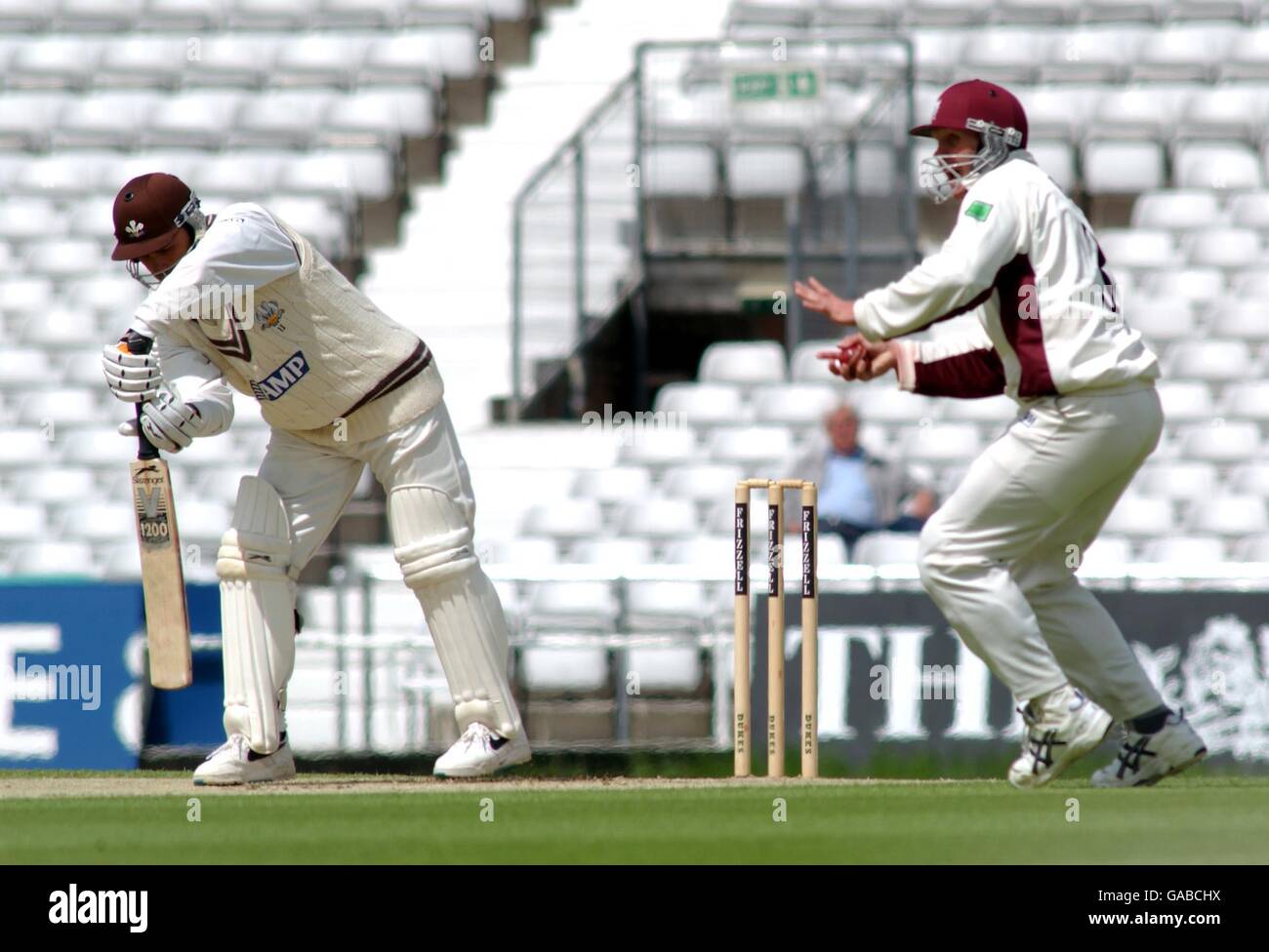 Surrey's Mark Ramprakash puts the ball right into the hands of Somerset's Mike Burns (L) to be caught out off the bowling of Matt Bulbeck Stock Photo