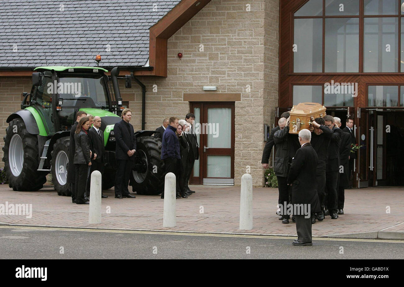 The coffin of former quad bike champion, Graeme Duncan, 37, who died in the helicopter crash that killed rally driver Colin McRae, is carried to a waiting hearse following his funeral. Stock Photo