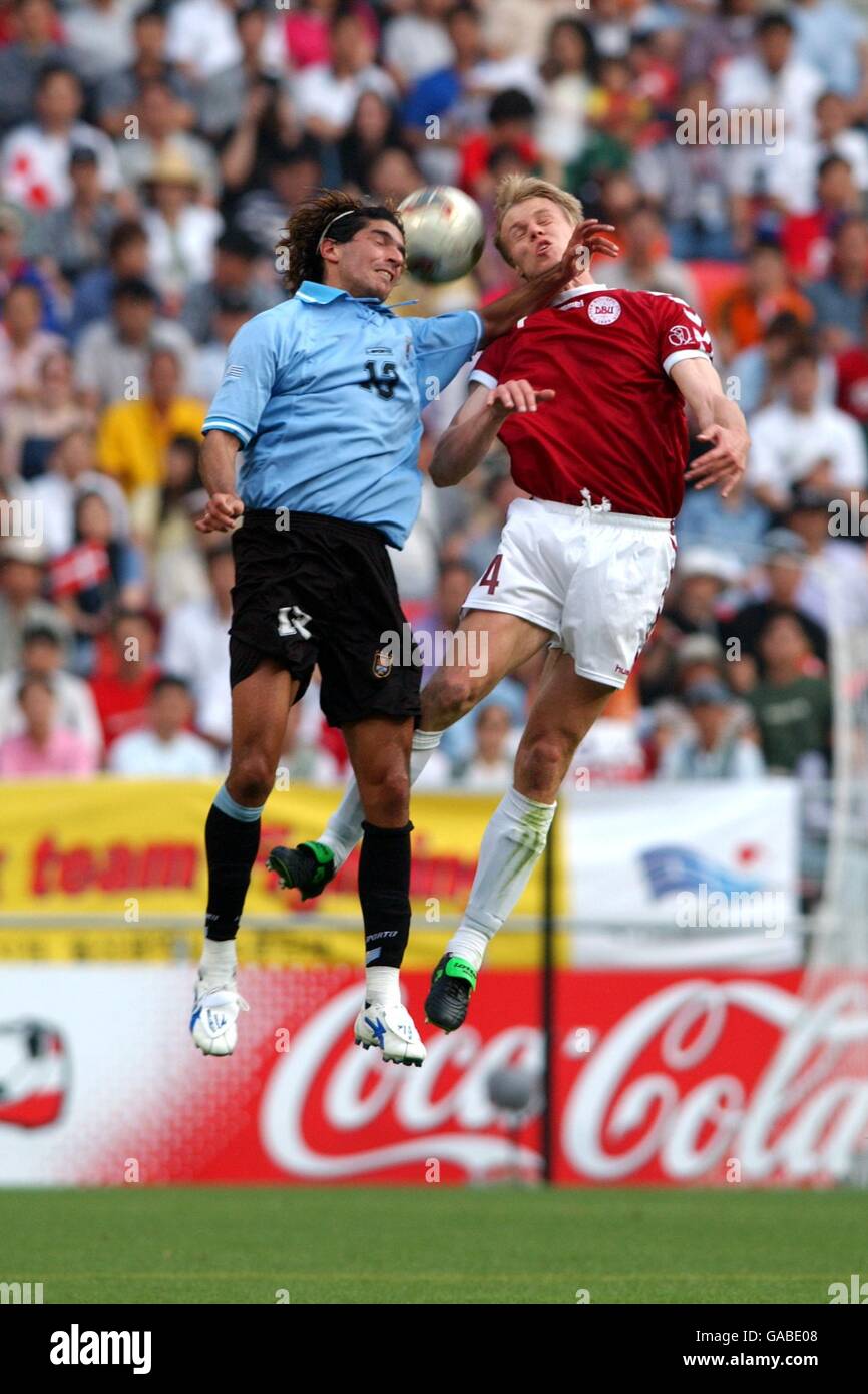 Soccer - FIFA World Cup 2002 - Group A - Uruguay v Denmark. Uruguay's Sebastian Abreu and Denmark's Martin Laursen Stock Photo