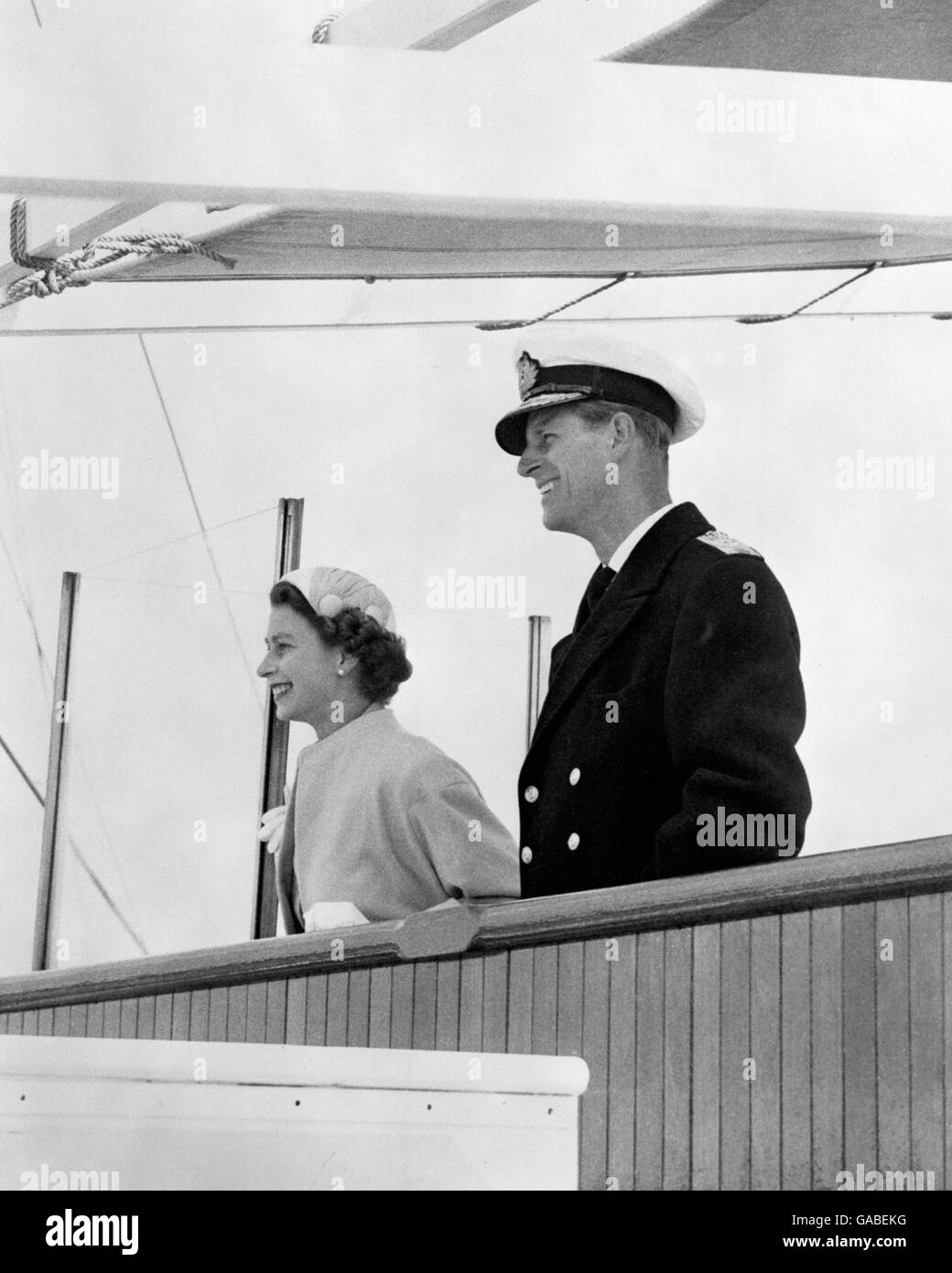 Queen Elizabeth II and her husband, Prince Philip, Duke of Edinburgh, on the foredeck of the SS Gothic just of the coast of Tonga. Stock Photo
