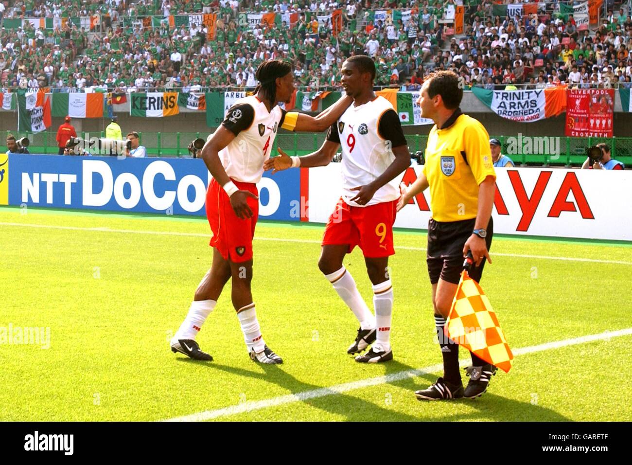 Soccer - FIFA World Cup 2002 - Group E - Cameroon v Ireland. Cameroon's captain Rigobert Song (l) congratulates Samuel Eto'o for his part in the opening goal against Ireland Stock Photo