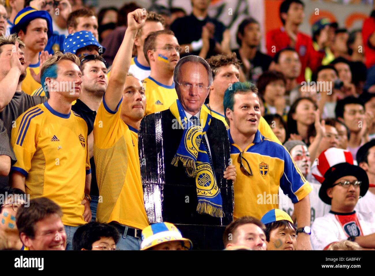 Swedish fans hold up a cardboard cut out of their fellow countryman Sven Goran Eriksson who is the England Manager Stock Photo