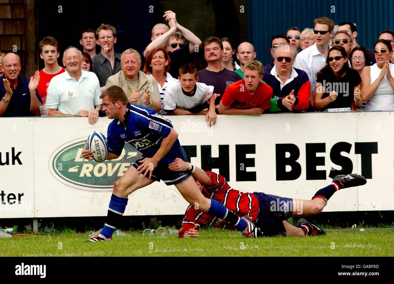 Sale Shark's Mark Cueto goes over to score a try despite the attention of Gloucester's Darren O'Leary Stock Photo