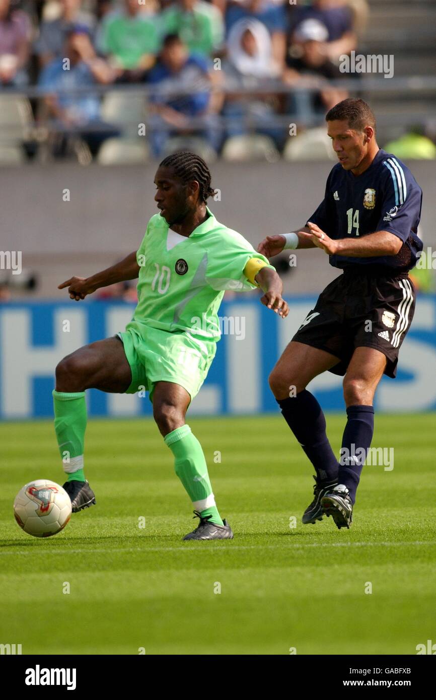 Nigeria S Jay Jay Okocha L Shields The Ball From Argentina S Diego Simeone Stock Photo Alamy