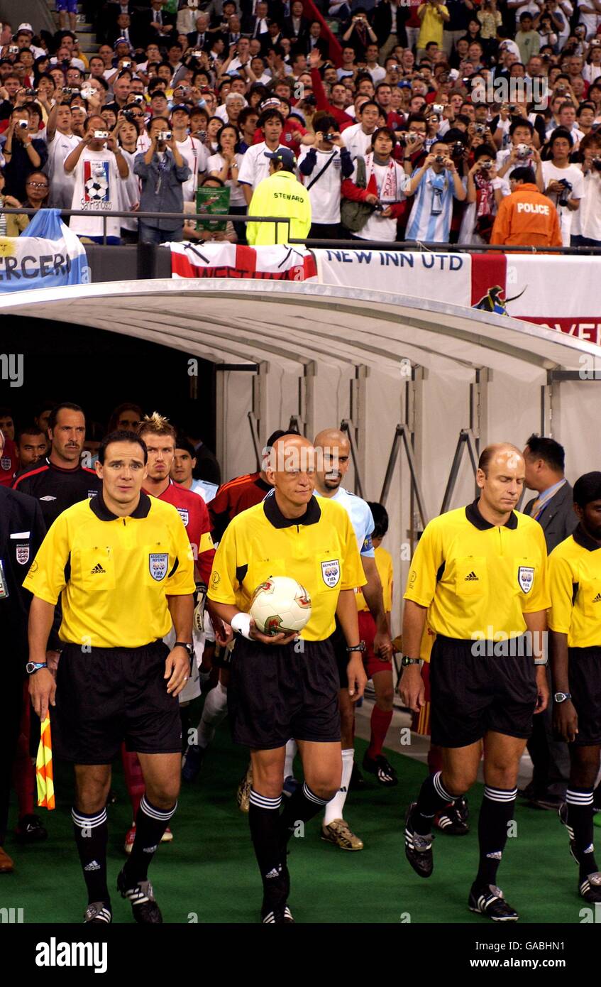 Referee Pierluigi Collina (centre) leads out the two sides with ...