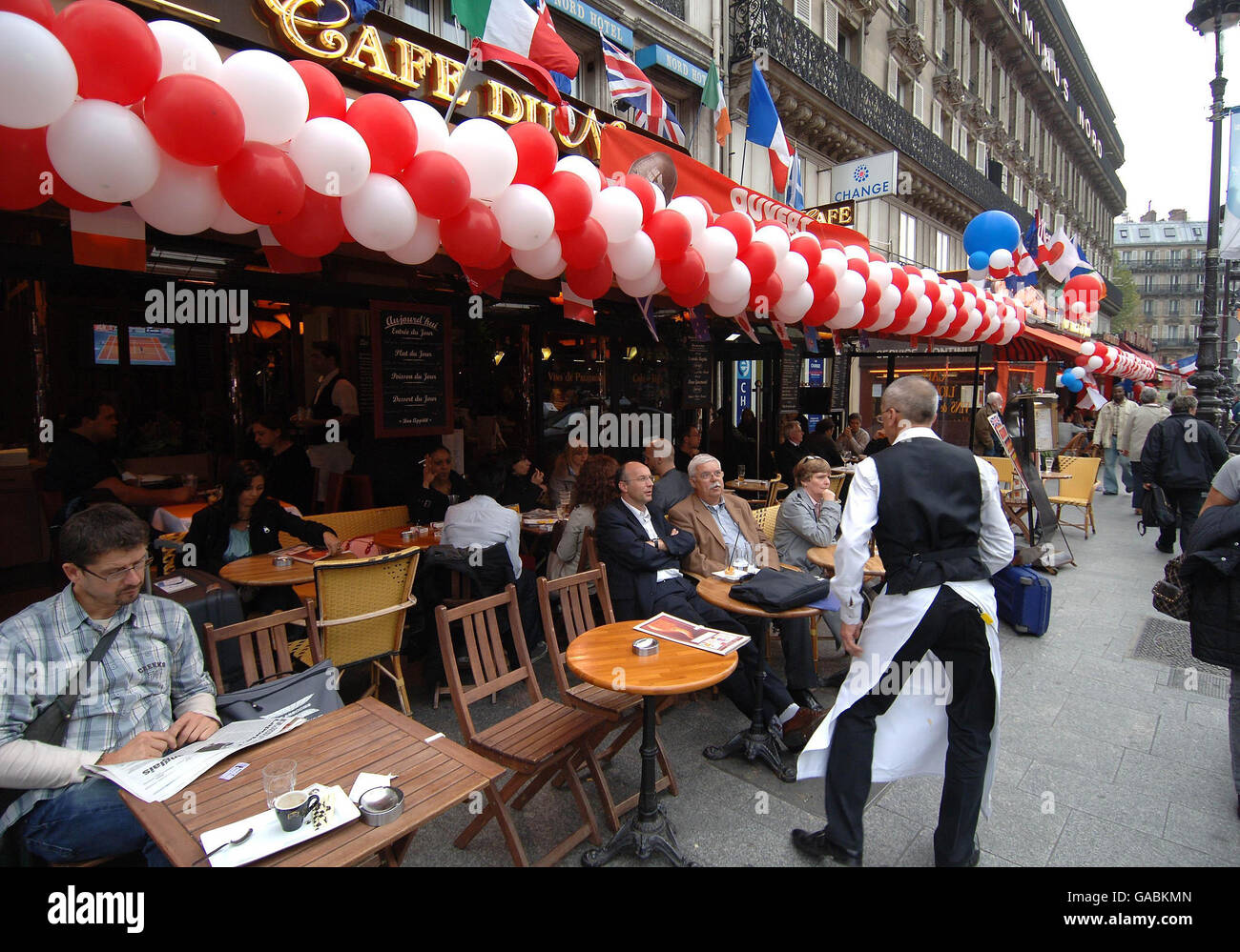 England play France in Paris in the Rugby World Cup Semi Final yet many of the bars and cafes in Paris are sporting the red and white colours of England and not the blue and white of their home team. Stock Photo