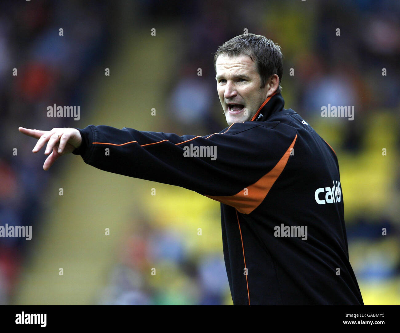 Blackpool manager Simon Grayson shouts from the touchline during the Coca-Cola Football League Championship match at Vicarage Road, Watford. Stock Photo
