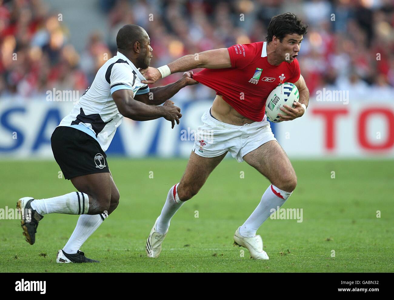 Rugby Union - IRB Rugby World Cup 2007 - Pool B - Wales v Fiji - Stade de la Beaujoire. Wales' Michael Phillips hands off the tackle Stock Photo