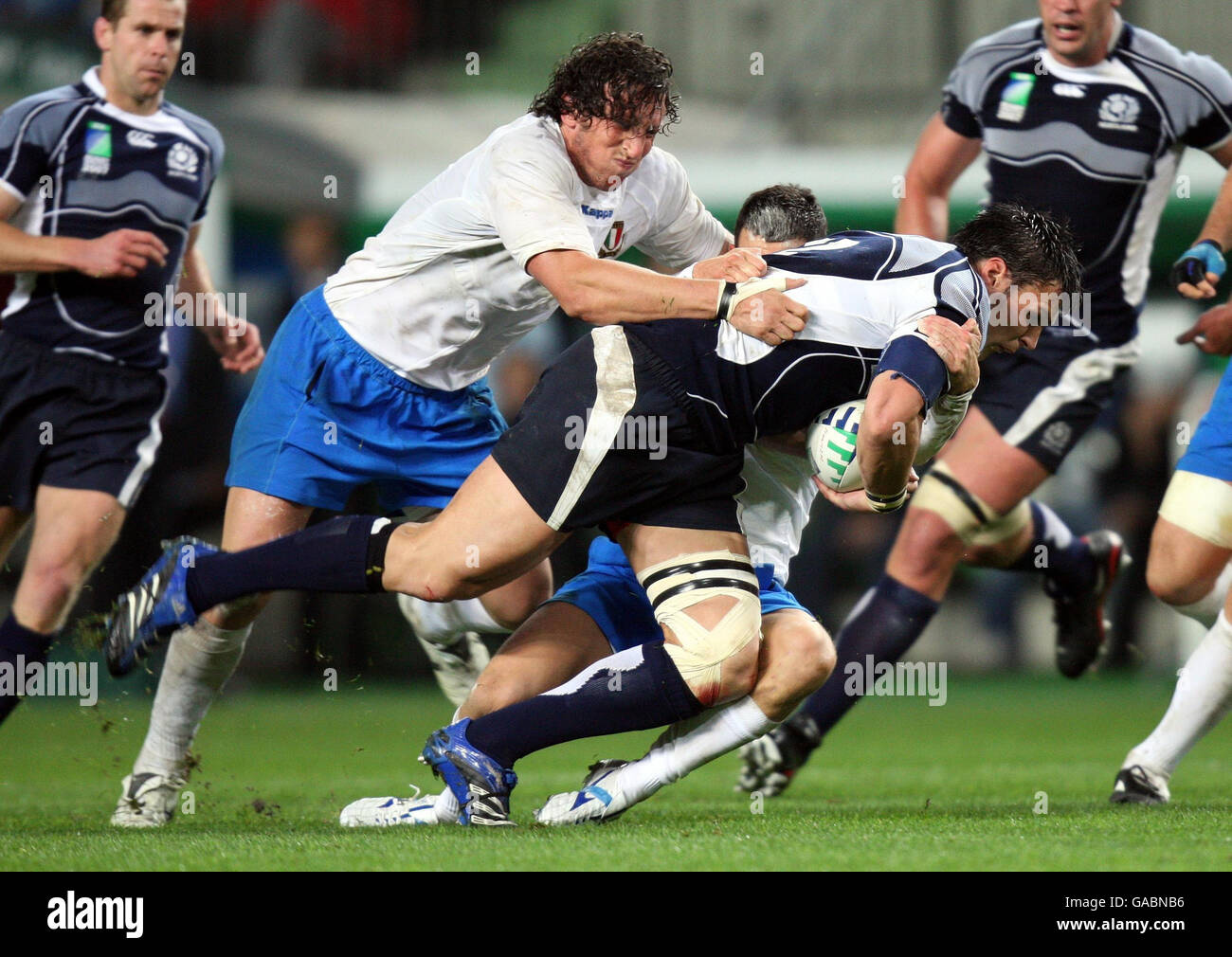 Scotland's Rob Dewey is tackled by Italy's Mauro Bergamasco during the IRB Rugby World Cup Pool C match at Stade Geoffroy-Guichard, St Etienne, France. Stock Photo