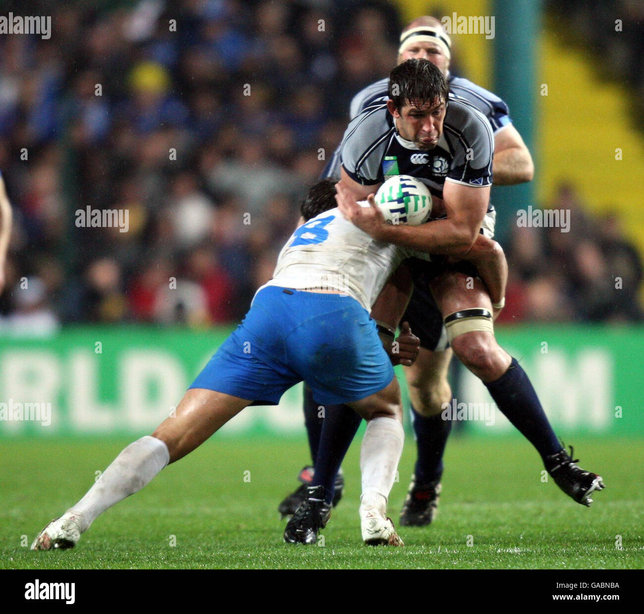 Scotland's Jim Hamilton is tackled by Italy's Sergio Parisse during the IRB Rugby World Cup Pool C match at Stade Geoffroy-Guichard, St Etienne, France. Stock Photo