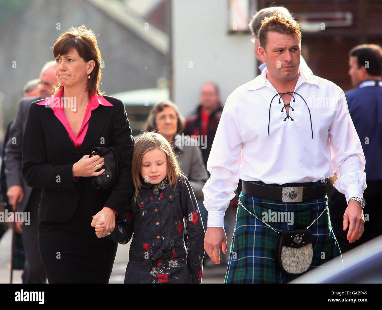 Colin McRae's brother Stuart McRae is pictured with Alison McRae and her daughter Holliew, as they arrive for the Service of Celebration for her husband Colin McRae and their son Johnny McRae taking place at St Nicholas Church, High Street in Lanark. Stock Photo