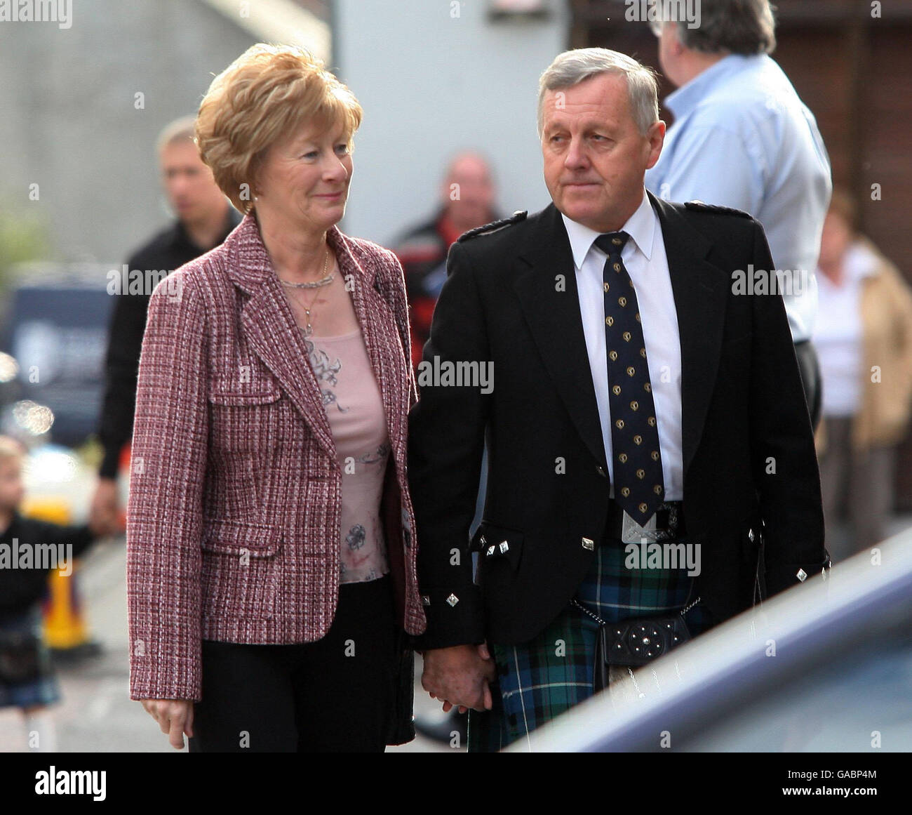 Jim McRae and his wife Margret arrive for the Service of Celebration for their son Colin McRae and their Grandson Johnny McRae taking place at St Nicholas Church, High Street in Lanark. Stock Photo