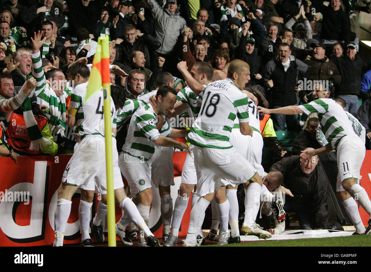 Celtic players celebrate Scott McDonald's winning goal during the UEFA Champions League Group D match at Celtic Park, Glasgow. Stock Photo