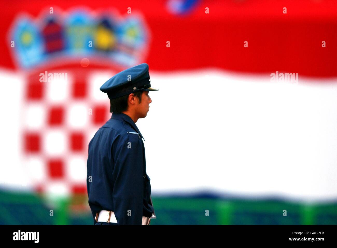 Soccer - FIFA World Cup 2002 - Group G - Croatia v Mexico. A Japanese Police Officer keeps an eye on the Croatia fans Stock Photo