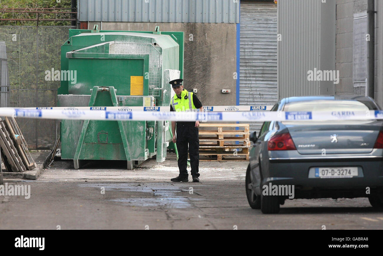 General view a police officer on guard at Dunhills Confectionery factory in Finglas, Dublin, after an explosion which left a man fighting for his life. Stock Photo
