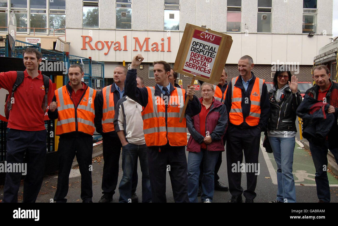 Postal workers acknowledge support from passing motorists as they picket the Royal Mail sorting office in York today during the national strike. Stock Photo