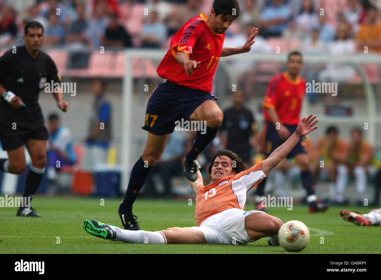 Spain's Juan Carlos Valeron is tackled by Paraguay's Carlos Paredes Stock Photo