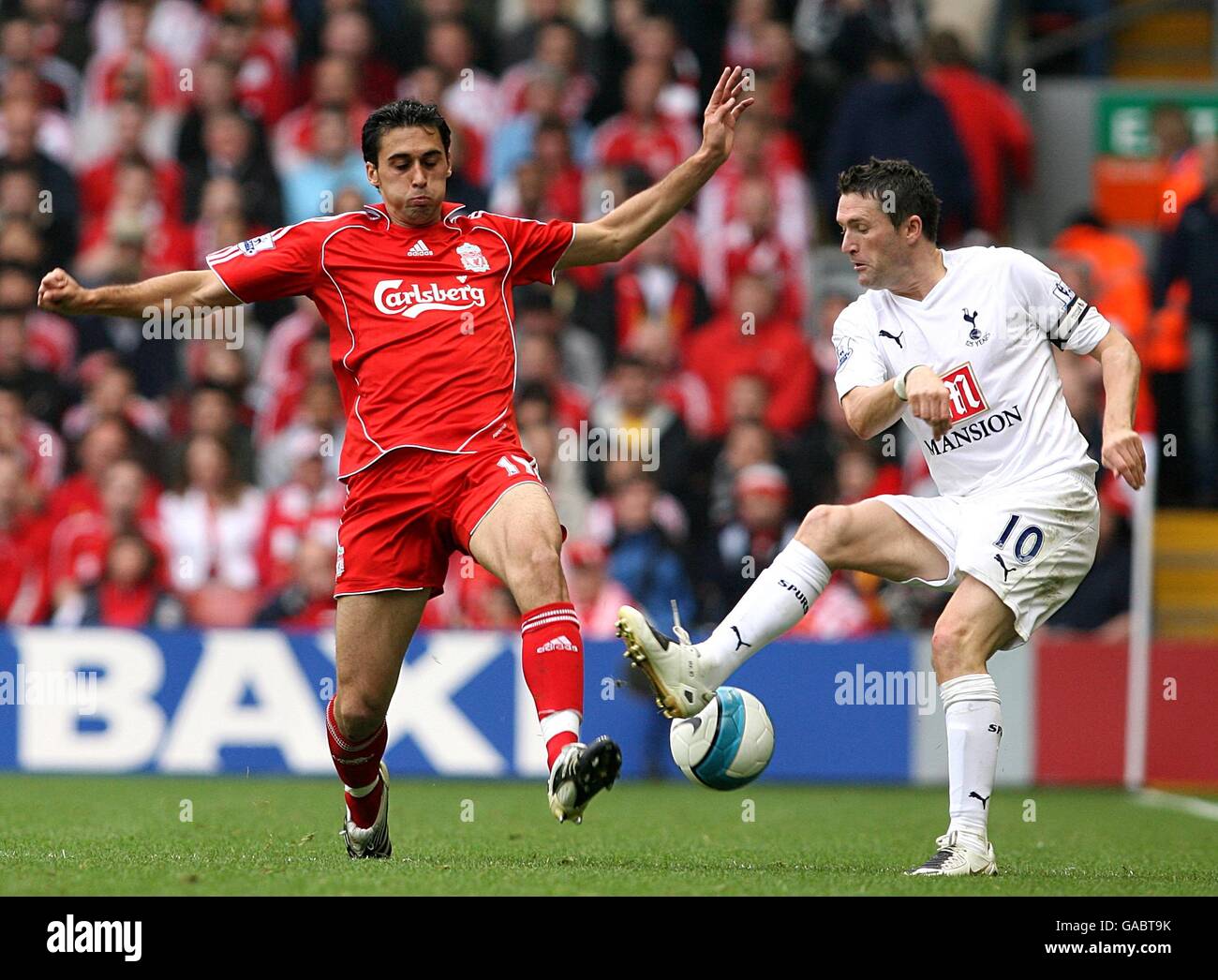 Soccer - Barclays Premier League - Liverpool v Tottenham Hotspur - Anfield. Liverpool's Alvaro Arbeloa (l) and Tottenham Hotspur's Robbie Keane (r) battle for the ball Stock Photo