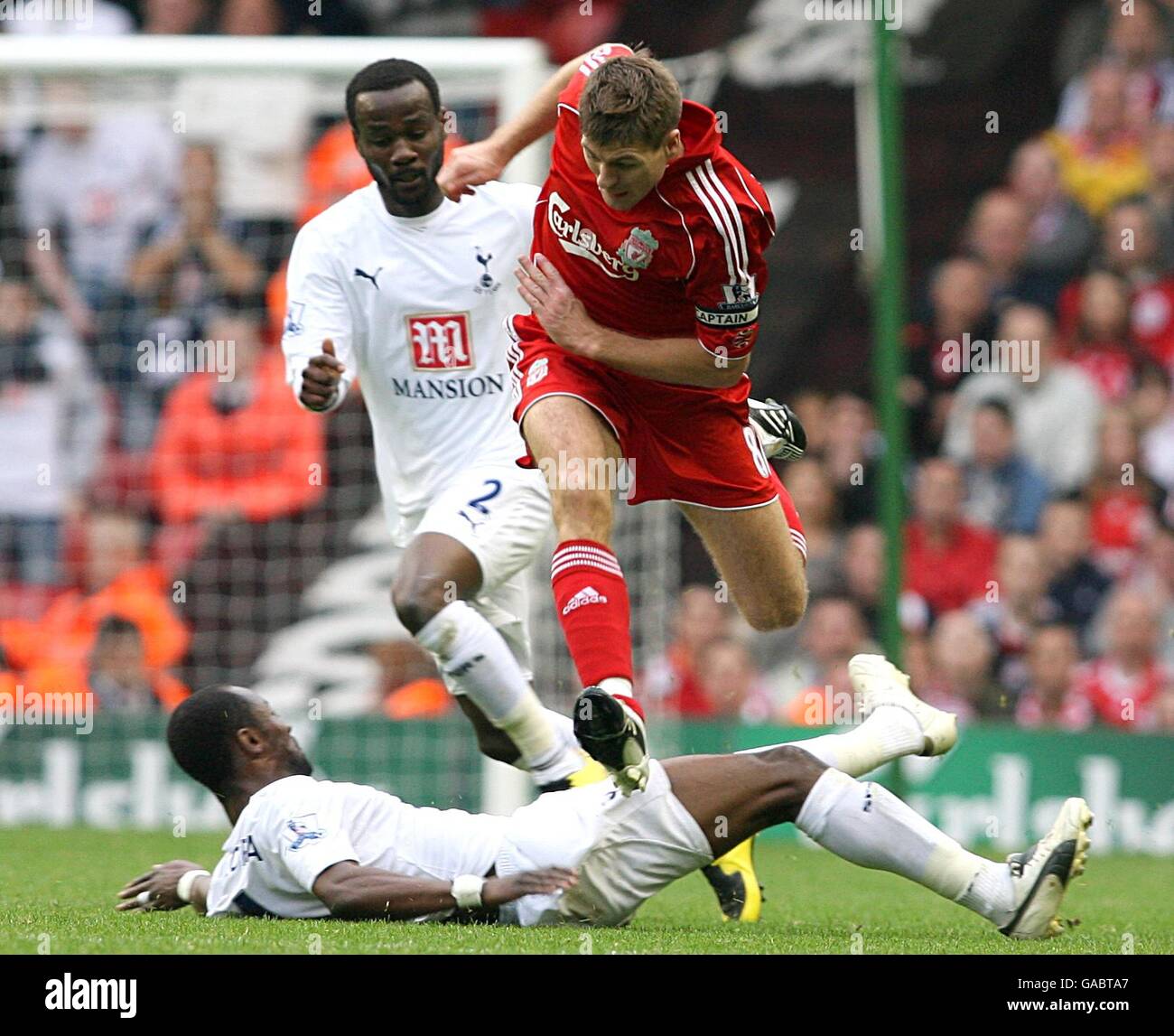 Soccer - Barclays Premier League - Liverpool v Tottenham Hotspur - Anfield. Liverpool's Steven Gerrard and Tottenham Hotspur's Didier Zokora battle for the ball Stock Photo