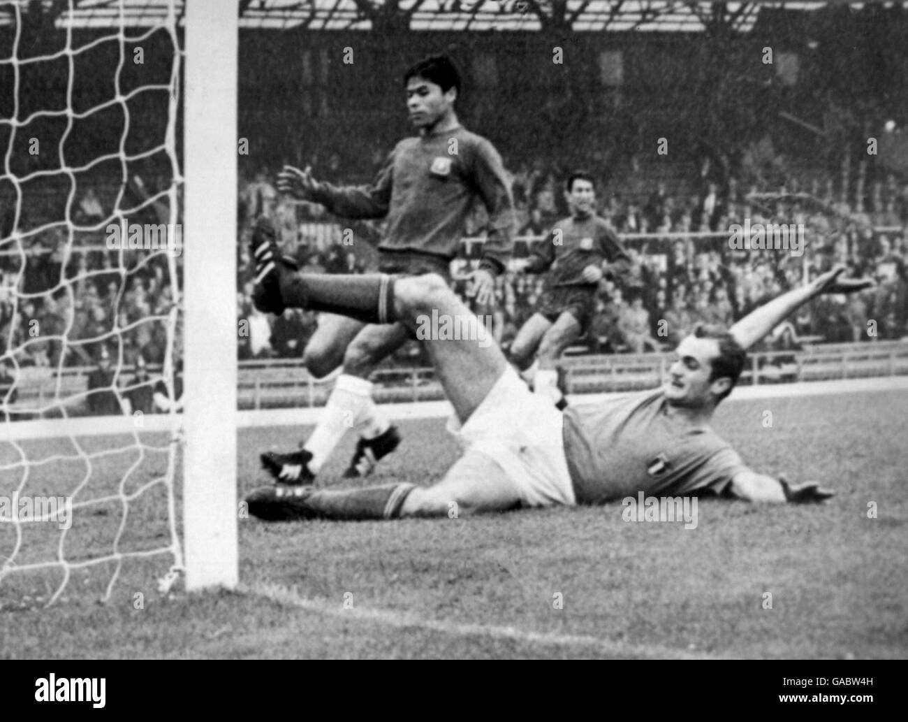 Italy's Sandro Mazzola slides in to score the opening goal in Italy's 2-0 win Stock Photo