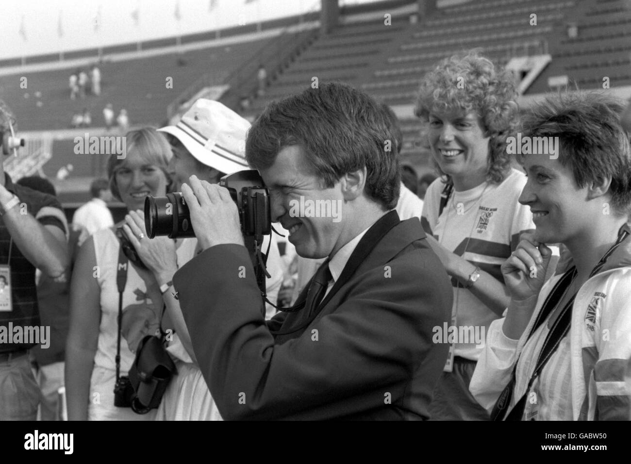 Minister for Sport Colin Moynihan takes a souvenir snap of the triumphant Great Britain team following their 3-1 win over West Germany in the final Stock Photo