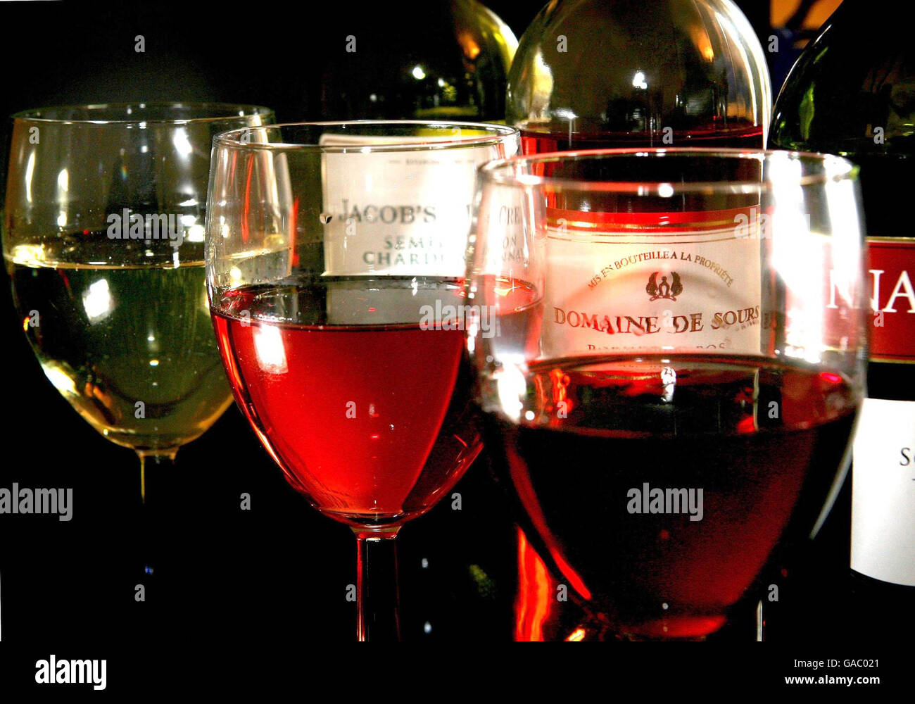 Generic image of wine filled glasses. Experts have warned of the dangers of routine over-consumption of alcohol as new figures were published showing people in relatively affluent areas are more likely to be drinking at levels considered 'hazardous' to health. Stock Photo