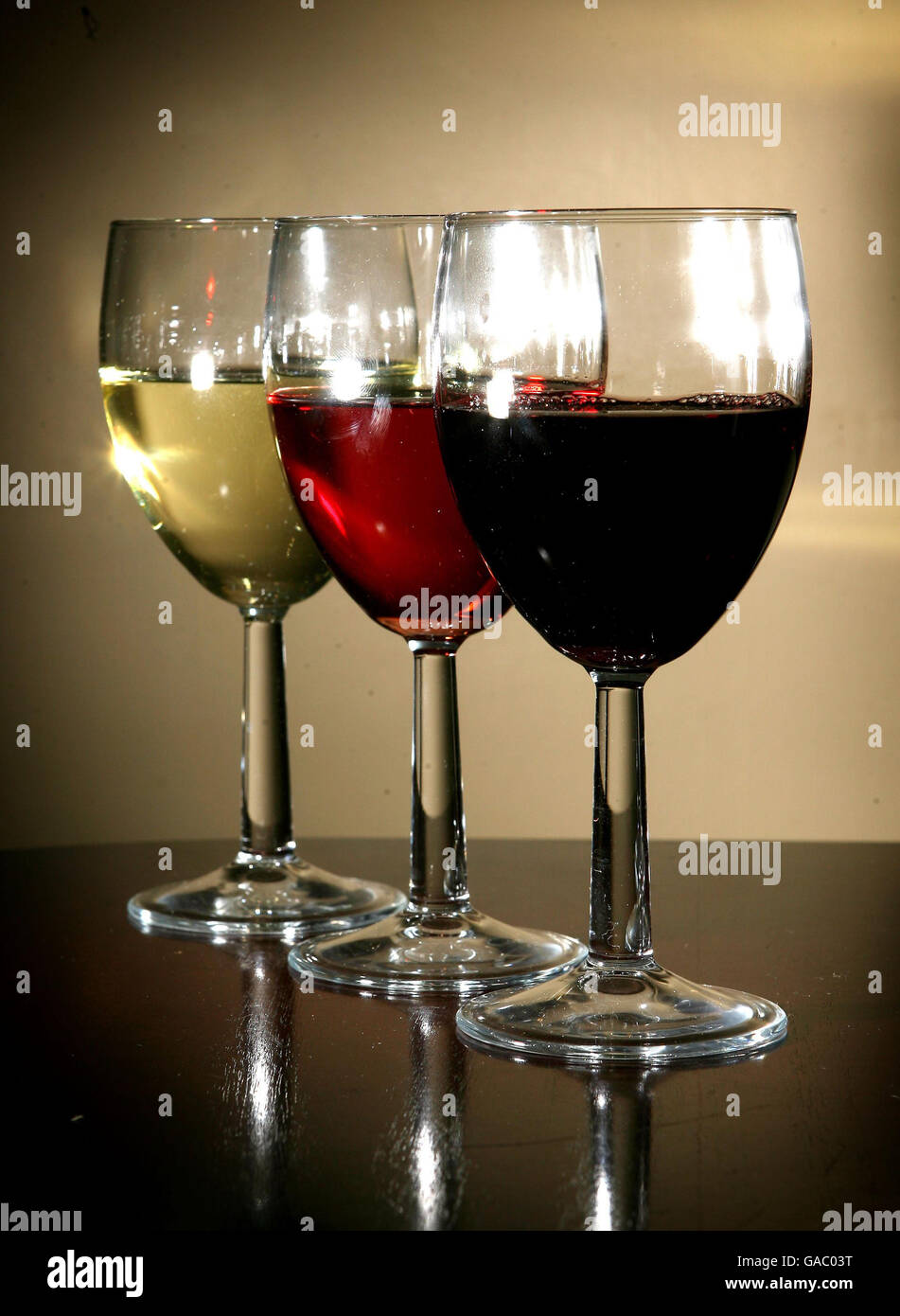 Generic image of wine filled glasses. Experts have warned of the dangers of routine over-consumption of alcohol as new figures were published showing people in relatively affluent areas are more likely to be drinking at levels considered 'hazardous' to health. Stock Photo