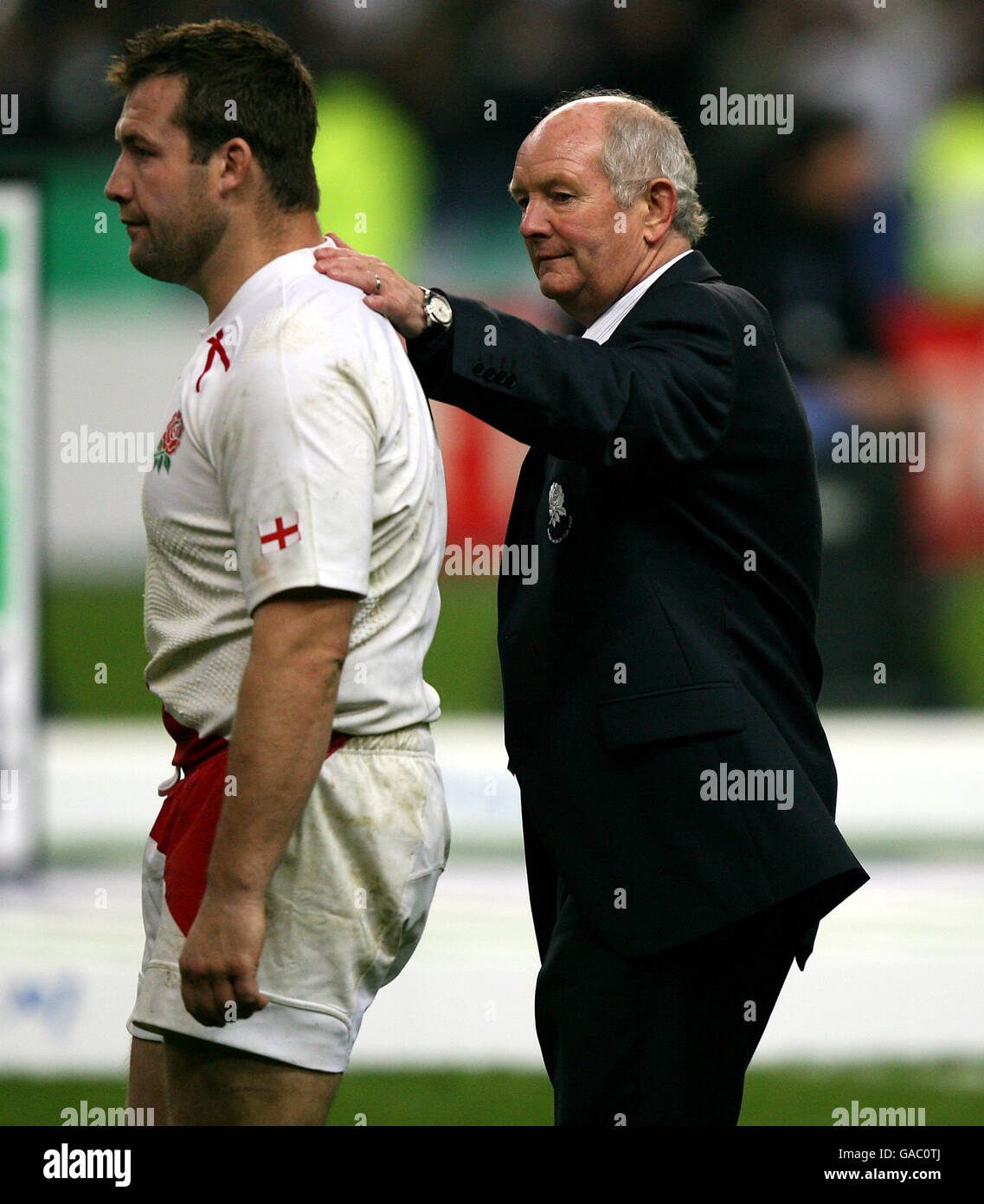 England's coach Brian Ashton consoles Mark Regan at the final whistle ...