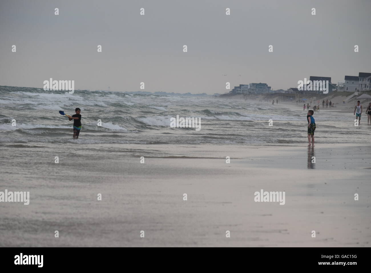 Kids playing on the beach Stock Photo - Alamy