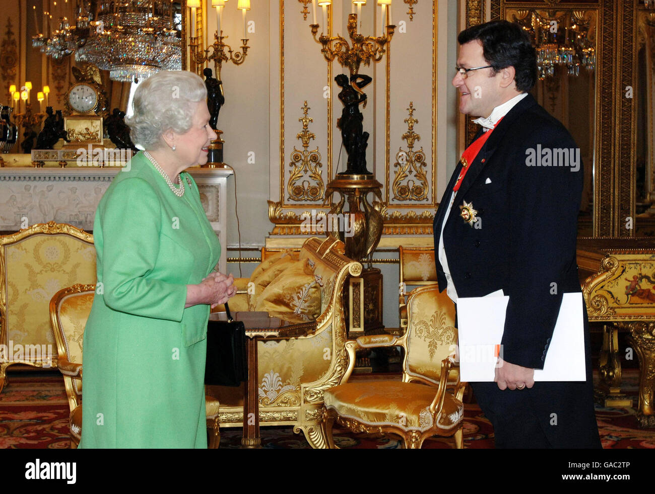 Britain's Queen Elizabeth II receives the Ambassador of Albania, Mr Zef Mazi, in the White Drawing Room at Buckingham Palace today. Stock Photo